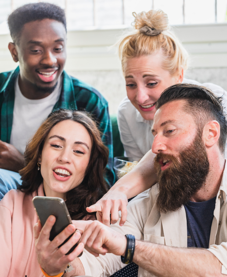Friends looking at Meta Ads and Google Ads on a phone in Boston, Massachusetts
